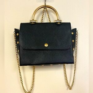 Elegant Black Handbag with Gold Accents